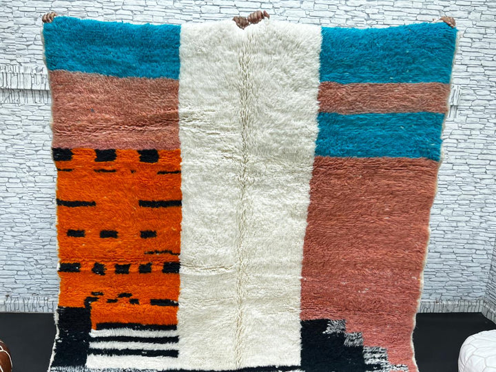 Colorful Moroccan wool rug with terracotta, turquoise blue, ivory, orange, and gray geometric color blocks