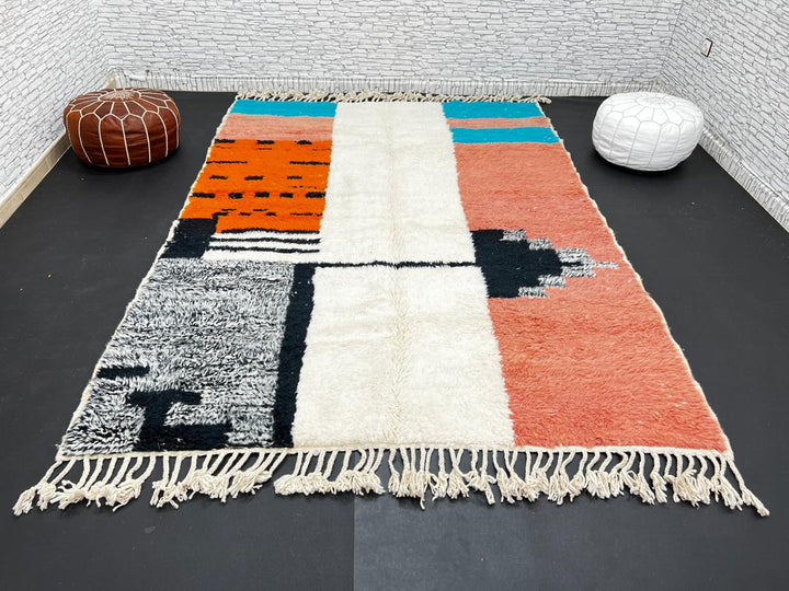 Colorful Moroccan wool rug with terracotta, turquoise blue, ivory, orange, and gray geometric color blocks