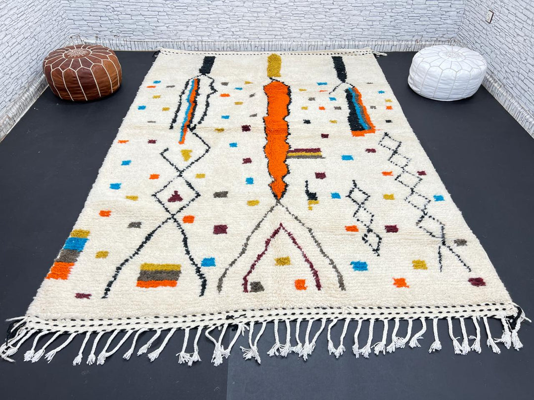 Handwoven Moroccan wool rug with multicolor geometric motifs on an ivory background, colorful Berber rug