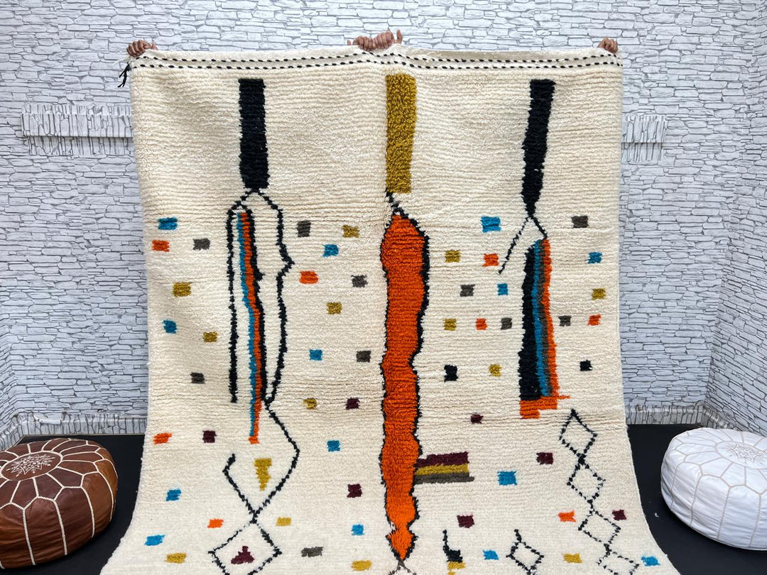 Handwoven Moroccan wool rug with multicolor geometric motifs on an ivory background, colorful Berber rug