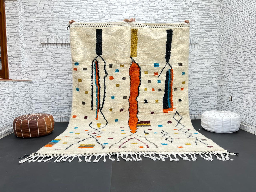 Handwoven Moroccan wool rug with multicolor geometric motifs on an ivory background, colorful Berber rug