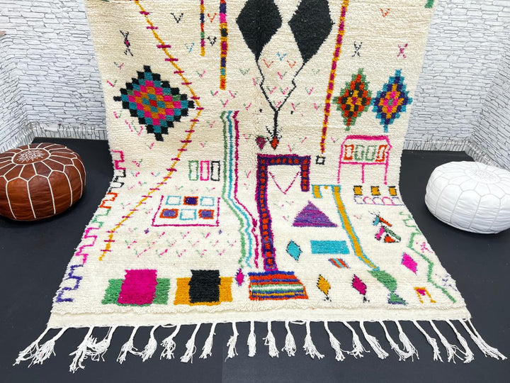 Handwoven colorful Moroccan wool rug with geometric Berber motifs on ivory background