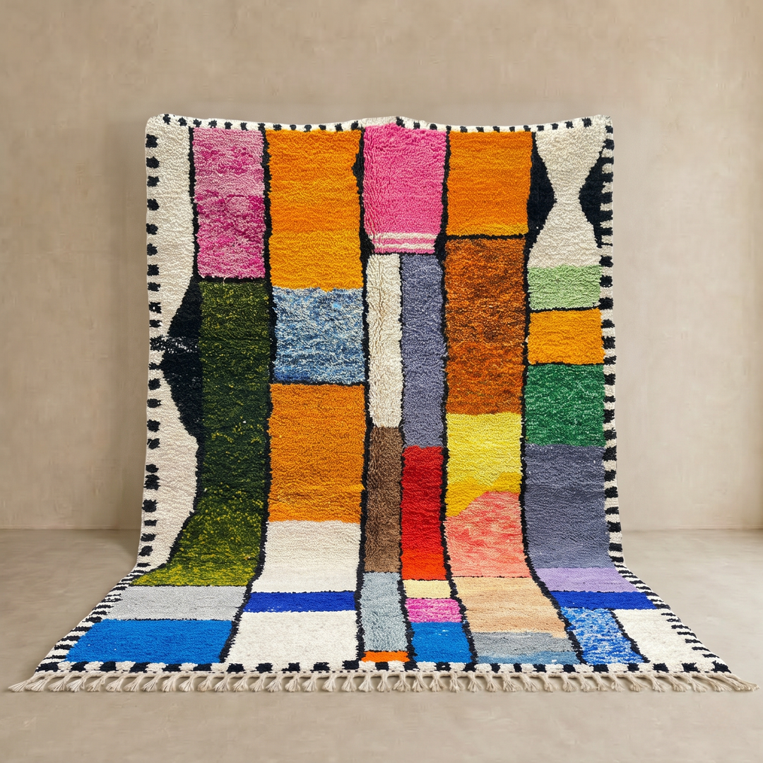 Colorful handmade Moroccan wool rug with a geometric patchwork design.