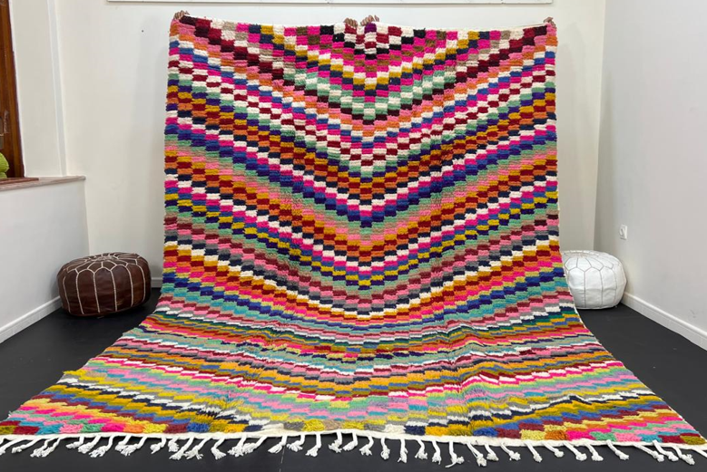 Colorful Moroccan wool rug with layered geometric Berber pattern and multicolor stripes