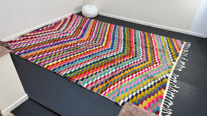 Colorful Moroccan wool rug with layered geometric Berber pattern and multicolor stripes