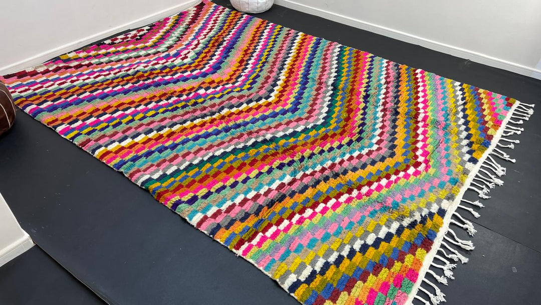 Colorful Moroccan wool rug with layered geometric Berber pattern and multicolor stripes