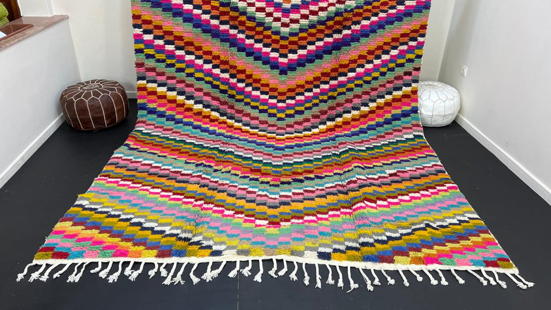 Colorful Moroccan wool rug with layered geometric Berber pattern and multicolor stripes