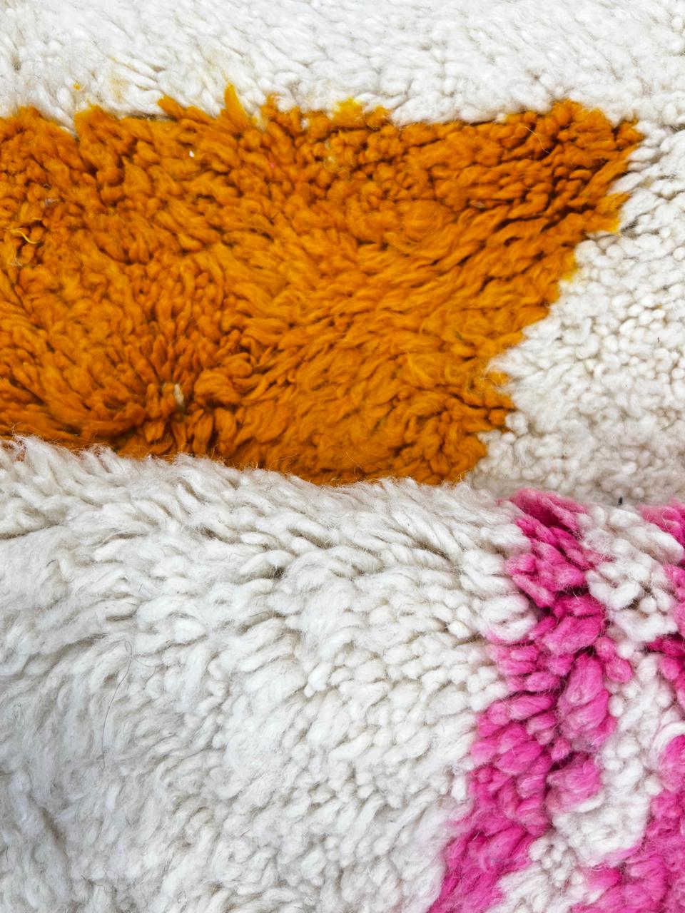Colorful handmade Moroccan wool runner rug with pink, brown, orange, and green geometric Berber design