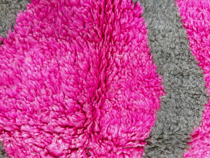 Colorful handmade Moroccan wool runner rug with pink, brown, orange, and green geometric Berber design