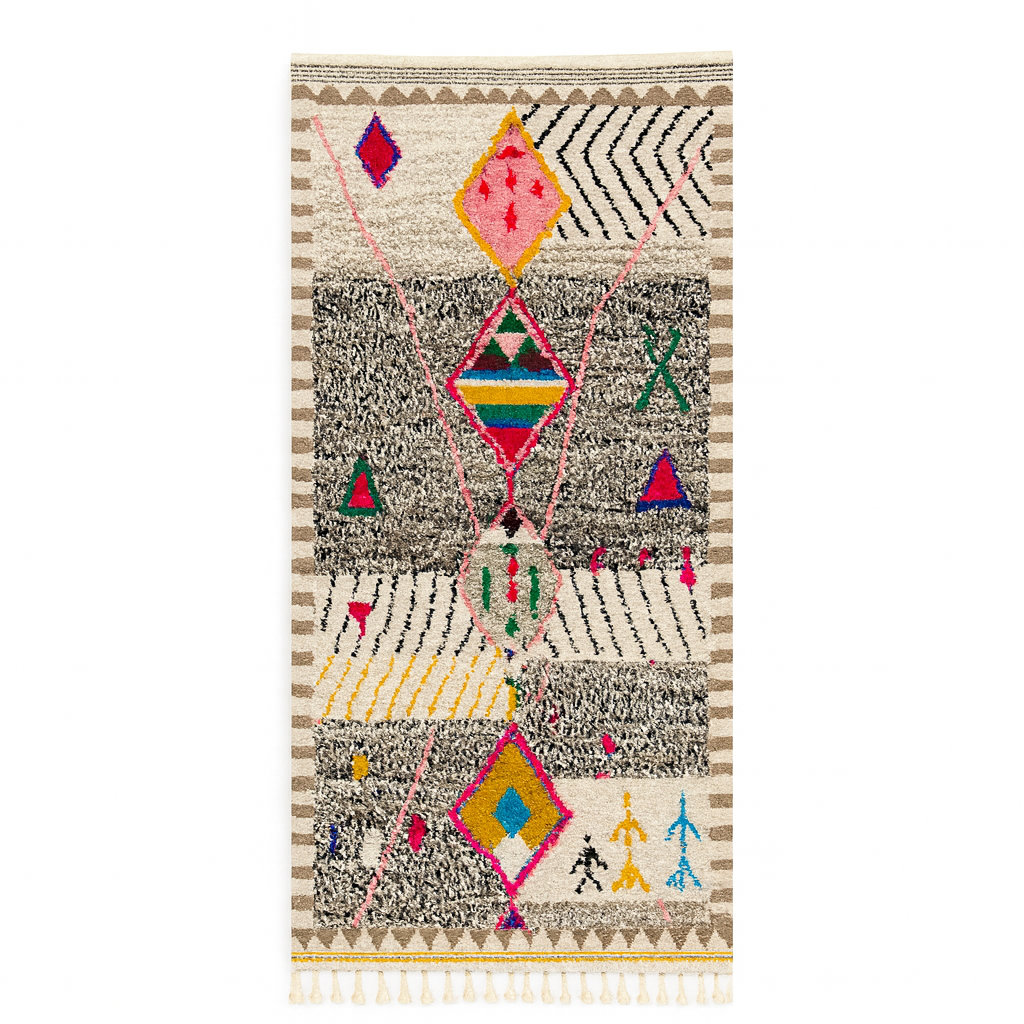 Handmade colorful Moroccan wool runner rug with geometric tribal patterns in pink, yellow, blue, green, and black on a white base.