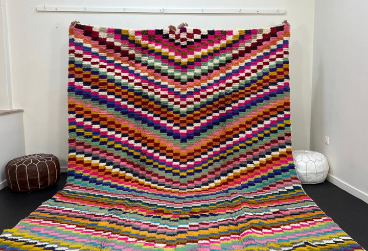 Colorful Moroccan wool rug with layered geometric Berber pattern and multicolor stripes