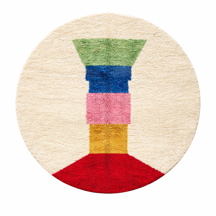Colorful round Moroccan wool rug with handmade Berber design on white background.