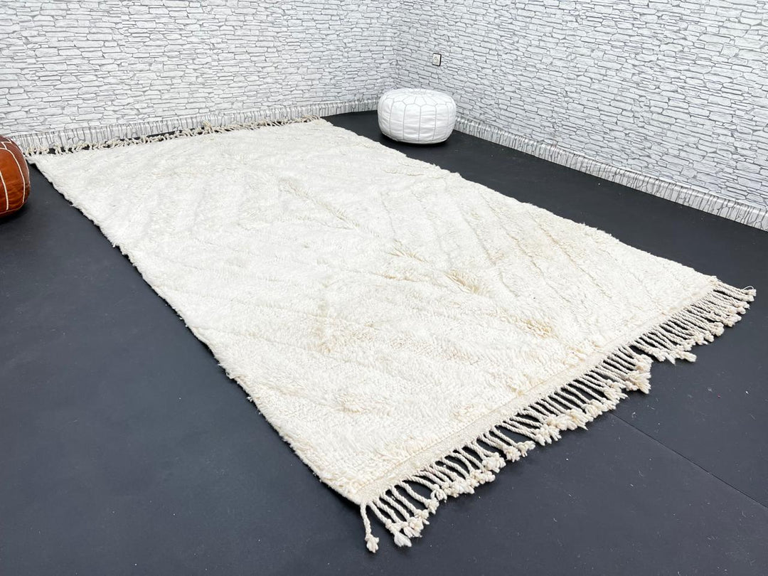 Handwoven cream Beni Ourain Moroccan wool rug with subtle chevron line pattern