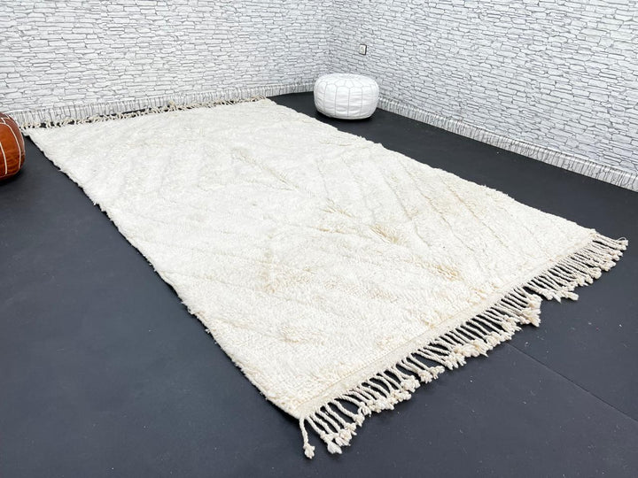 Handwoven cream Beni Ourain Moroccan wool rug with subtle chevron line pattern