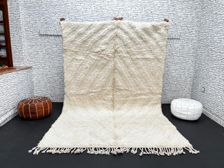Handwoven cream Beni Ourain Moroccan wool rug with subtle chevron line pattern