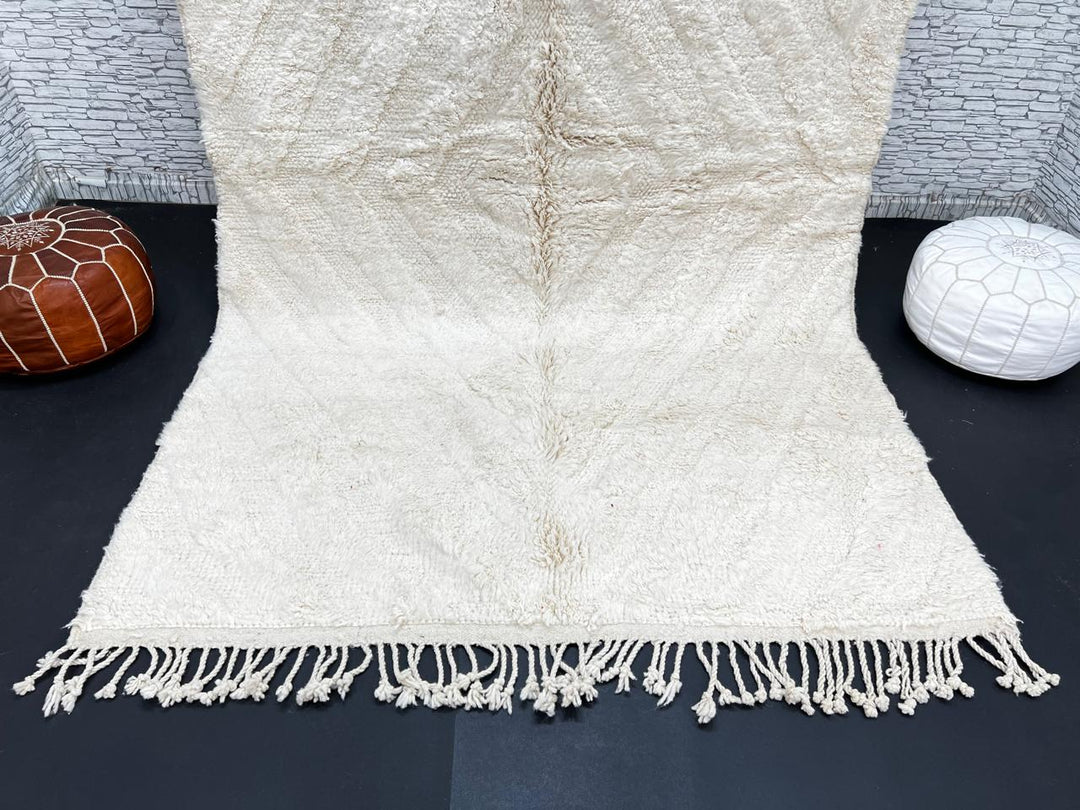 Handwoven cream Beni Ourain Moroccan wool rug with subtle chevron line pattern