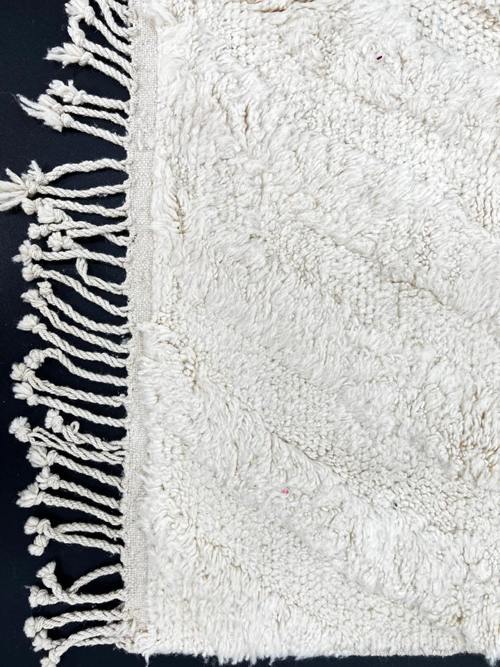 Handwoven cream Beni Ourain Moroccan wool rug with subtle chevron line pattern