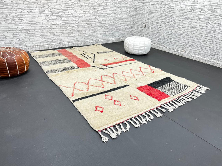 Handmade cream Moroccan wool rug with red and black geometric lines – modern Berber design