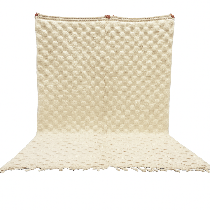 Cream textured Moroccan wool rug with raised dot design