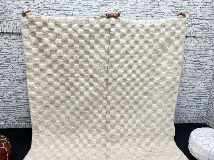 Cream textured Moroccan wool rug with raised dot design