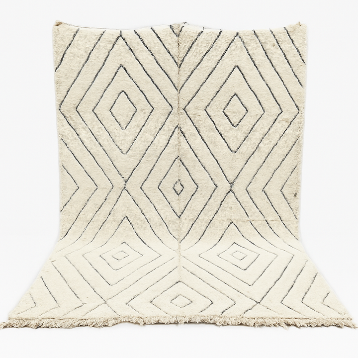 Handmade cream white Moroccan wool rug with black diamond lines and plush wool texture