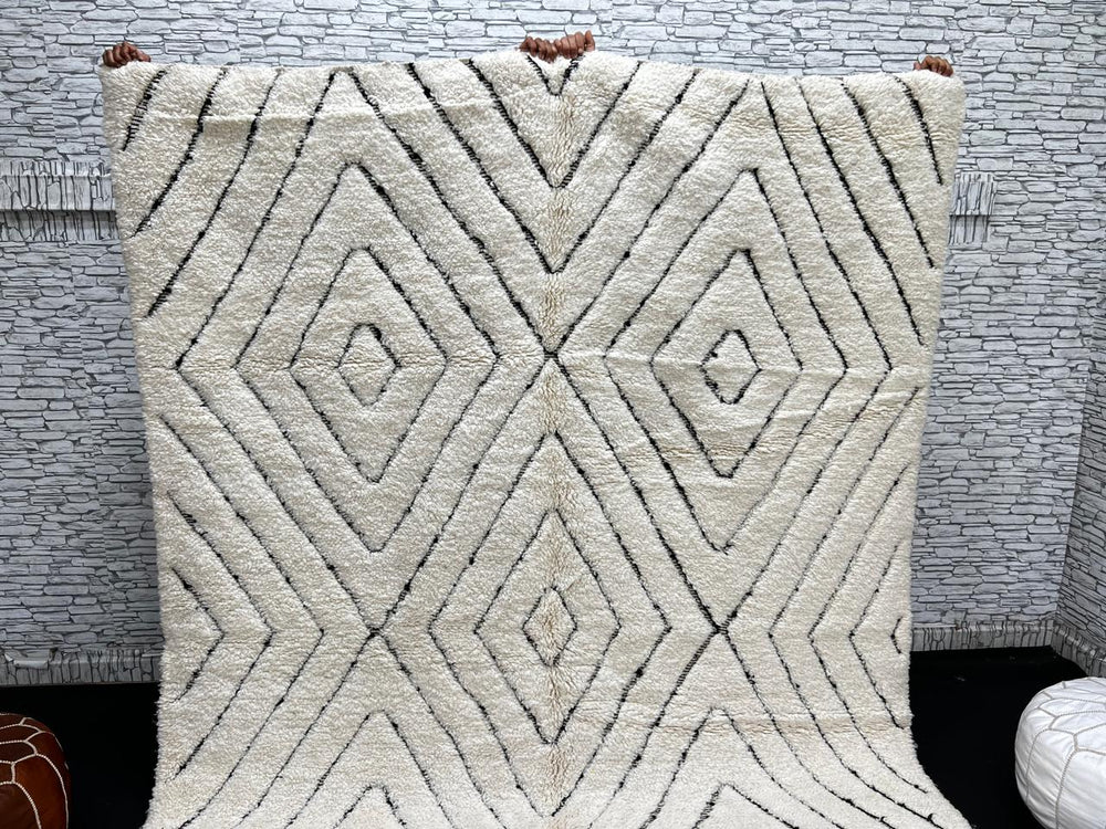 Handmade cream white Moroccan wool rug with black diamond lines and plush wool texture
