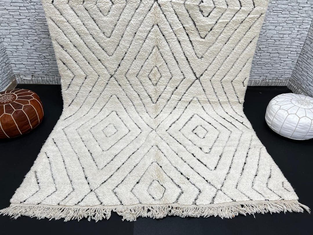 Handmade cream white Moroccan wool rug with black diamond lines and plush wool texture