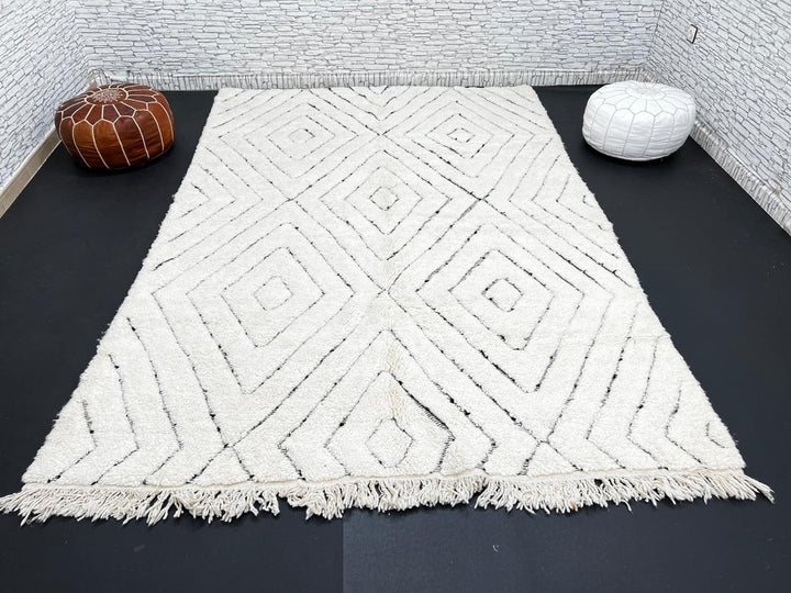 Handmade cream white Moroccan wool rug with black diamond lines and plush wool texture