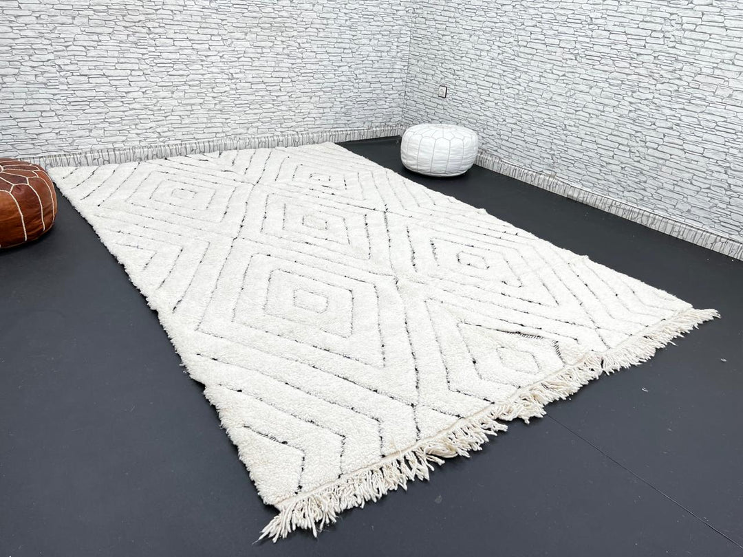 Handmade cream white Moroccan wool rug with black diamond lines and plush wool texture