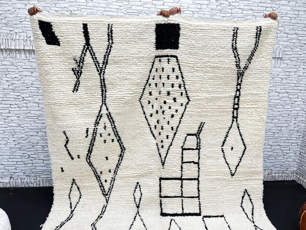 Handwoven cream and black Moroccan wool rug with geometric Beni Ourain design – handmade Berber carpet from Morocco