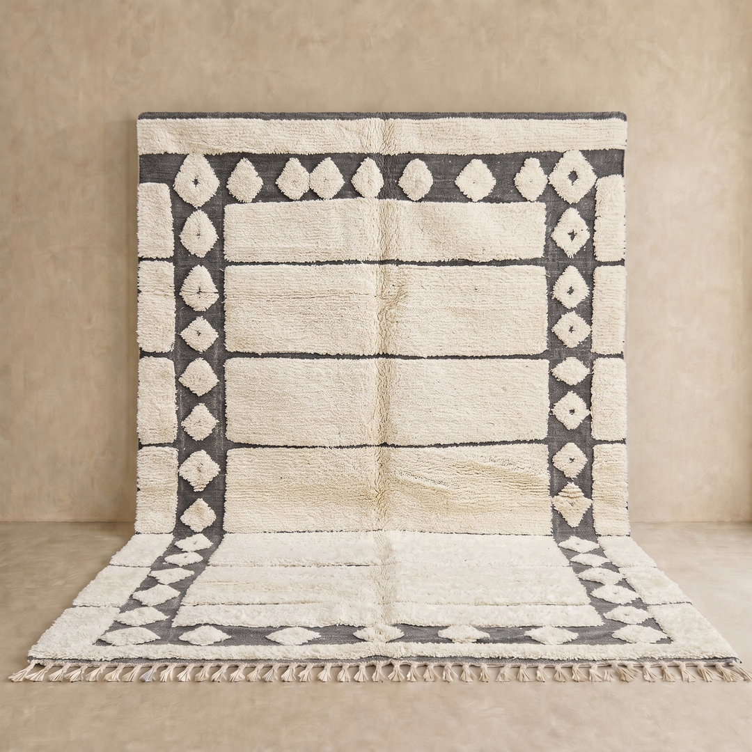 Cream Moroccan wool rug with charcoal gray geometric border and linear Berber pattern