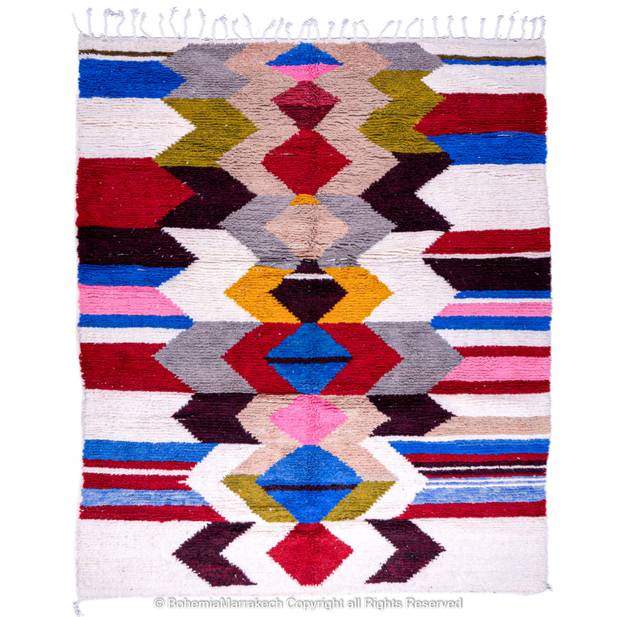 Colorful geometric Azilal Moroccan wool rug with diamond patterns in red, blue, pink, and green on an ivory background.