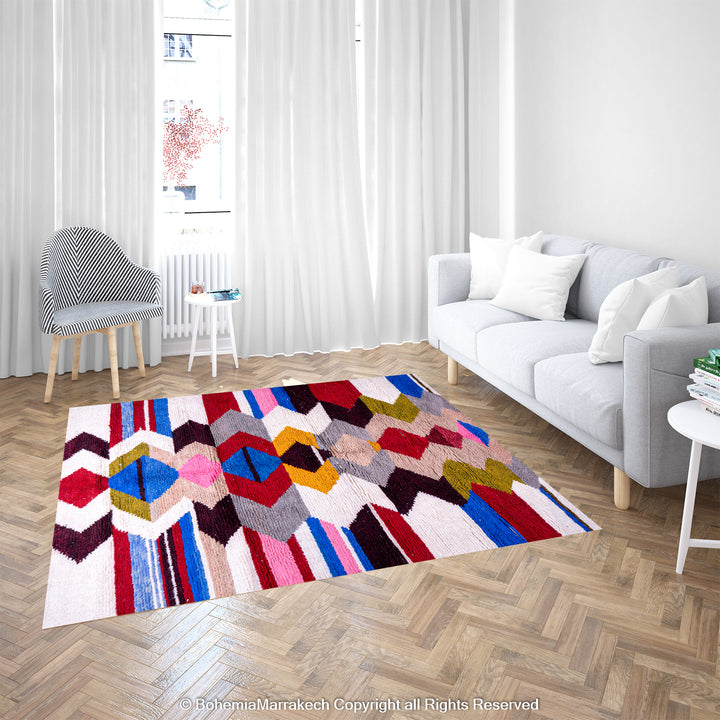 Colorful geometric Moroccan Azilal rug in modern living room with white sofa and curtains, showcasing vibrant diamond patterns.