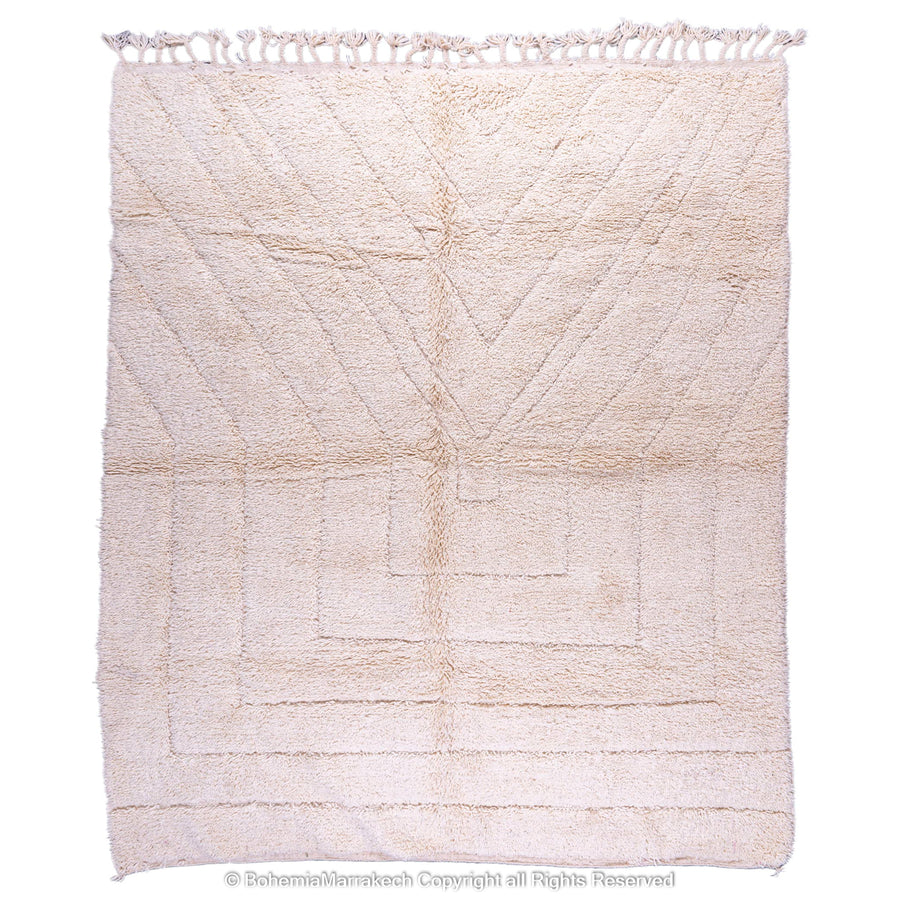 Cream Moroccan Berber wool rug with minimalist geometric pattern, handmade in the Atlas Mountains. Ideal for serene, modern interiors.