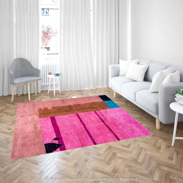 Colorful handmade Moroccan rug with geometric design in pink, blue, and brown wool shag in a modern living room setting.