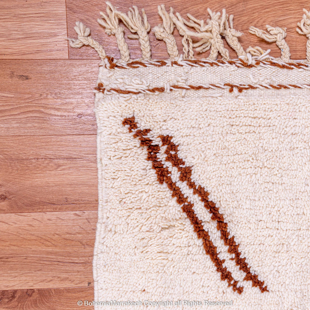 Close-up of a Modern Moroccan Rug with abstract brown and beige design, handwoven in wool by Berber artisans.