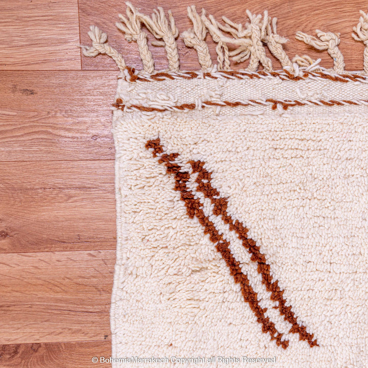 Close-up of a Modern Moroccan Rug with abstract brown and beige design, handwoven in wool by Berber artisans.