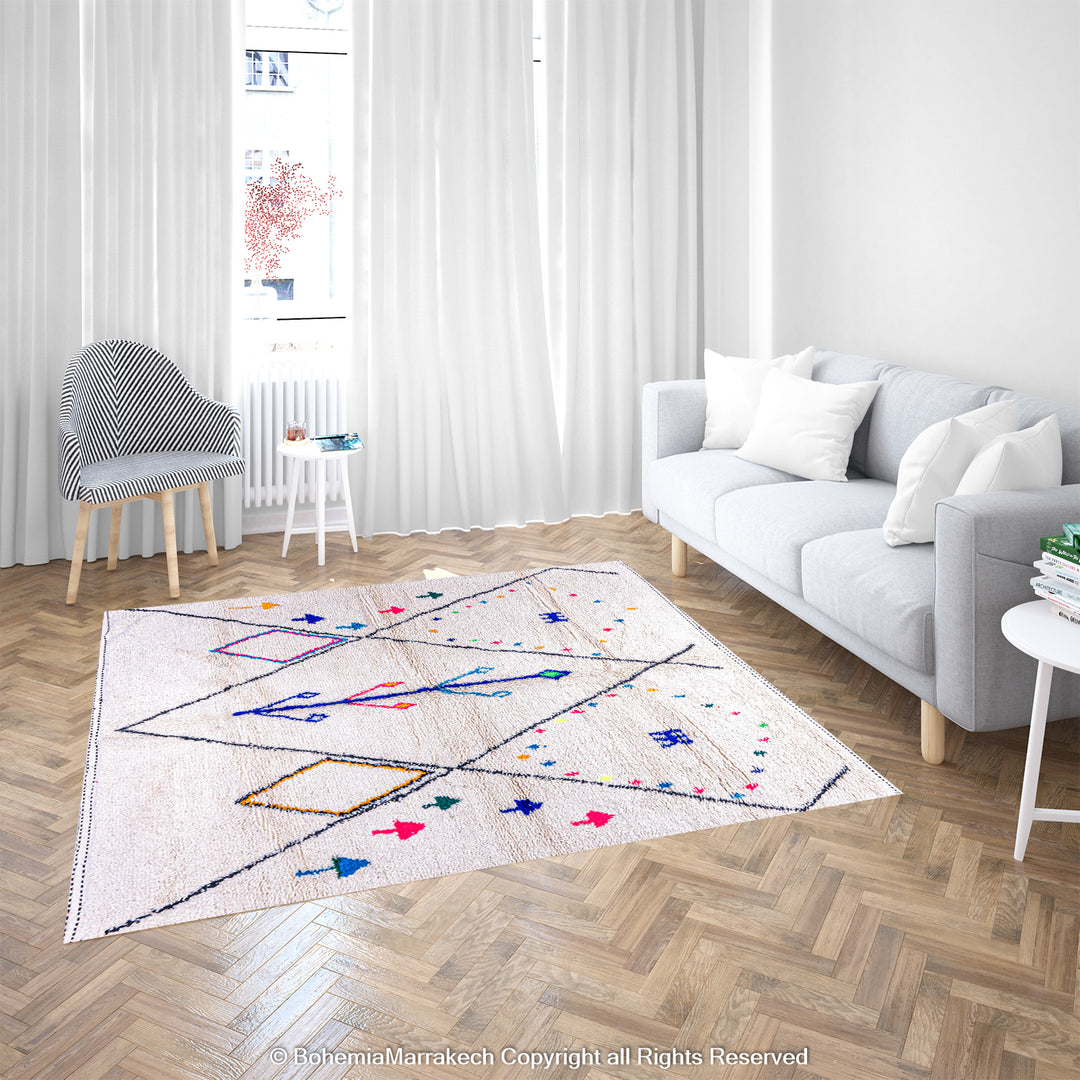 Colorful Azilal Moroccan rug with diamond patterns in a modern living room setting, featuring vibrant blue, pink, and green accents.
