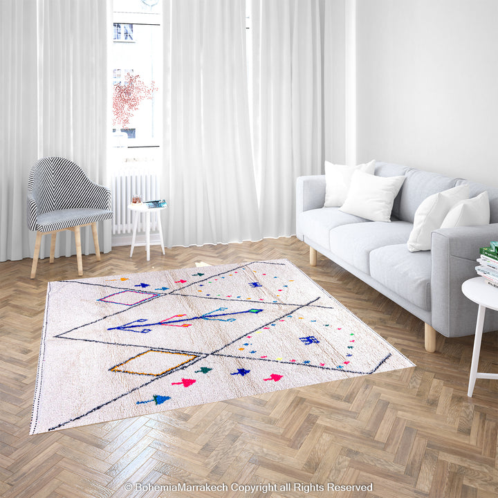 Colorful Azilal Moroccan rug with diamond patterns in a modern living room setting, featuring vibrant blue, pink, and green accents.