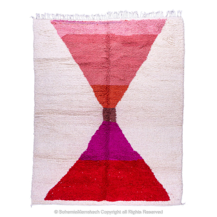 Handmade Moroccan Berber rug with red and pink hourglass design on natural wool base, 8x10 area rug, traditional Moroccan carpet.