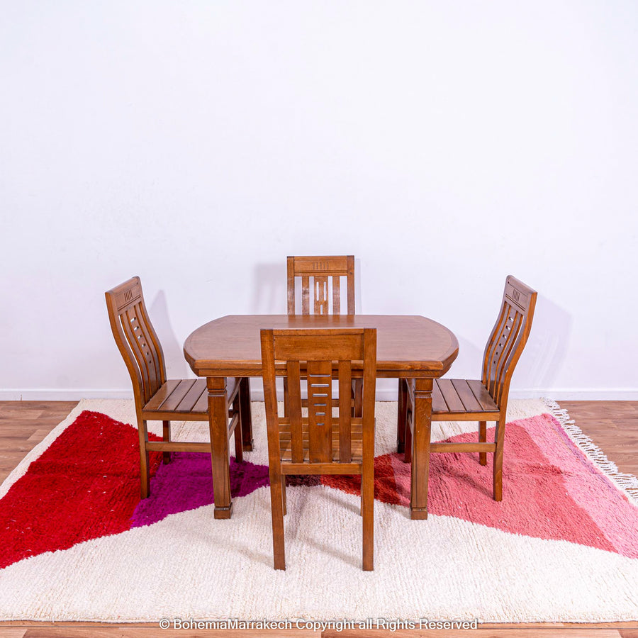 Handmade Moroccan Wool Rug with Red & Pink Hourglass Design under Dining Table Set