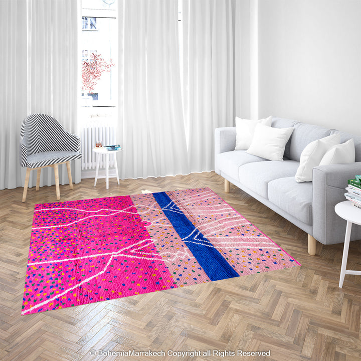 Pink and blue Moroccan rug with multicolor specks and geometric white lines