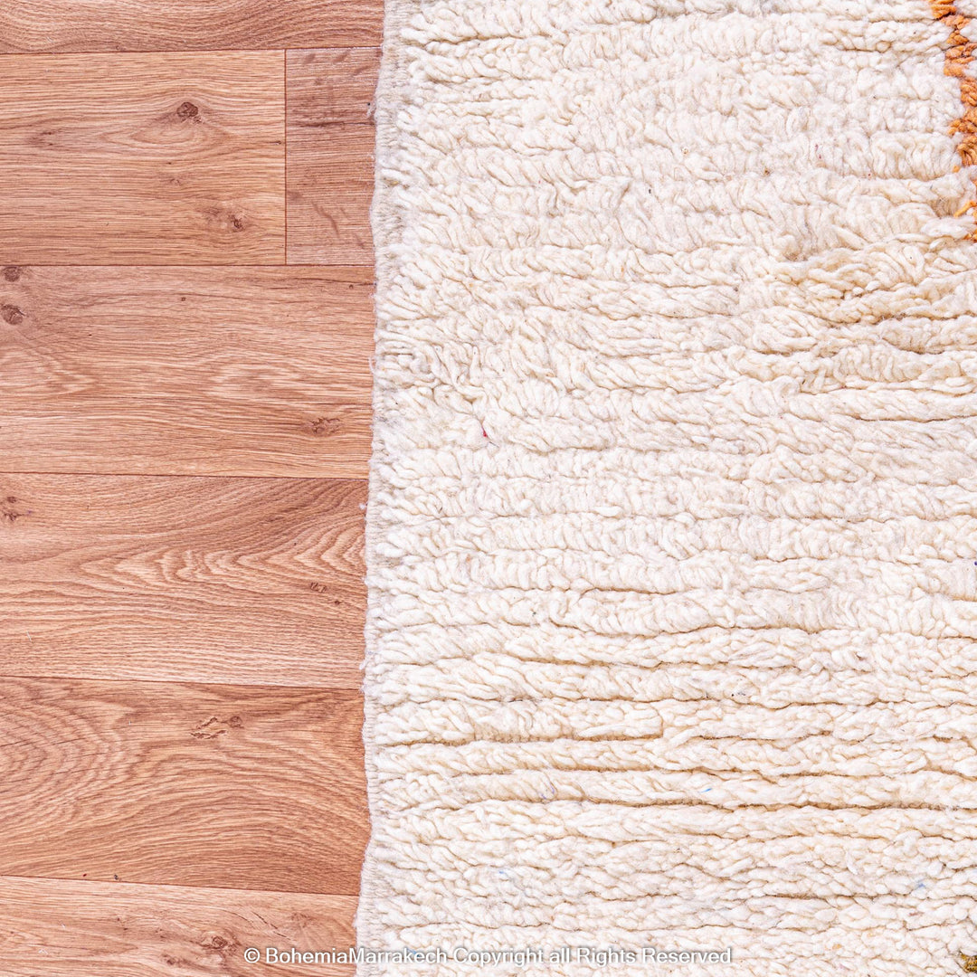 Minimal handmade Moroccan rug with diamond Berber motifs on white wool
