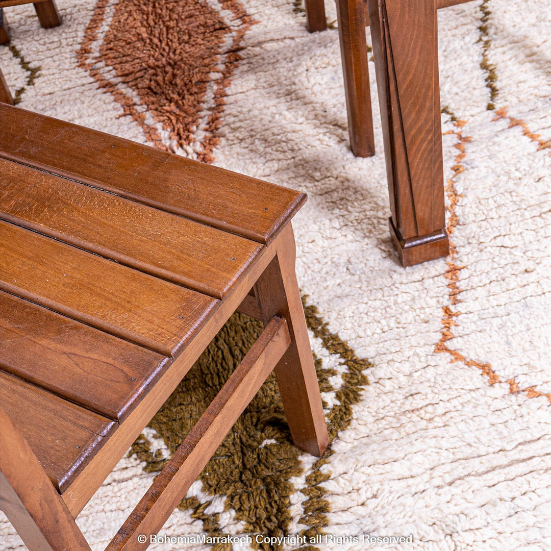 Minimal handmade Moroccan rug with diamond Berber motifs on white wool