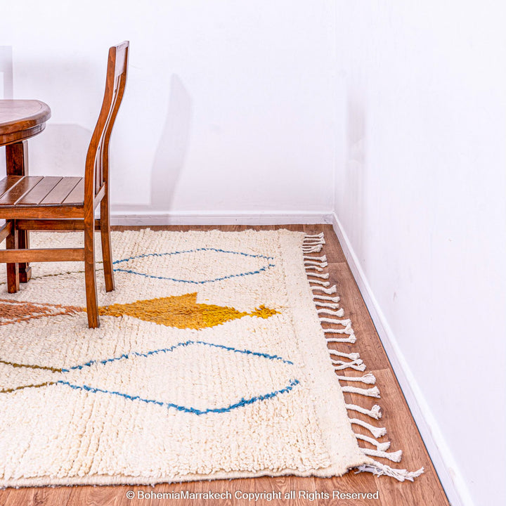 Minimal handmade Moroccan rug with diamond Berber motifs on white wool