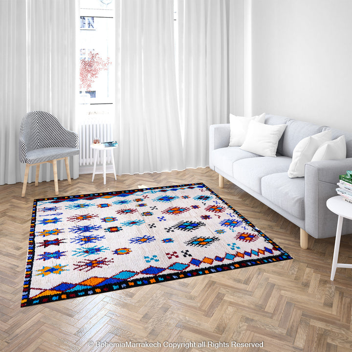 White Moroccan wool rug with colorful Berber tribal motifs and dark border – Beni Ourain handmade