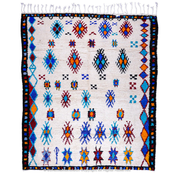 White Moroccan wool rug with colorful Berber tribal motifs and dark border – Beni Ourain handmade