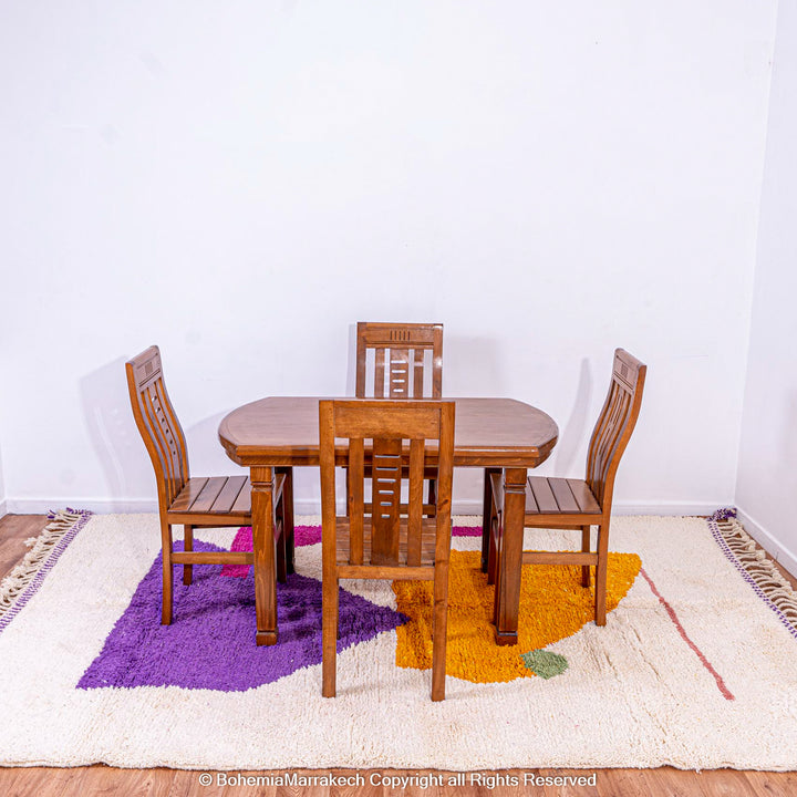 Abstract Moroccan wool rug with orange and purple geometric shapes on cream background
