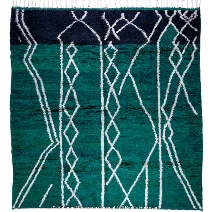 Green Moroccan rug with white tribal diamond lines and navy border, handmade in Beni Ourain wool style