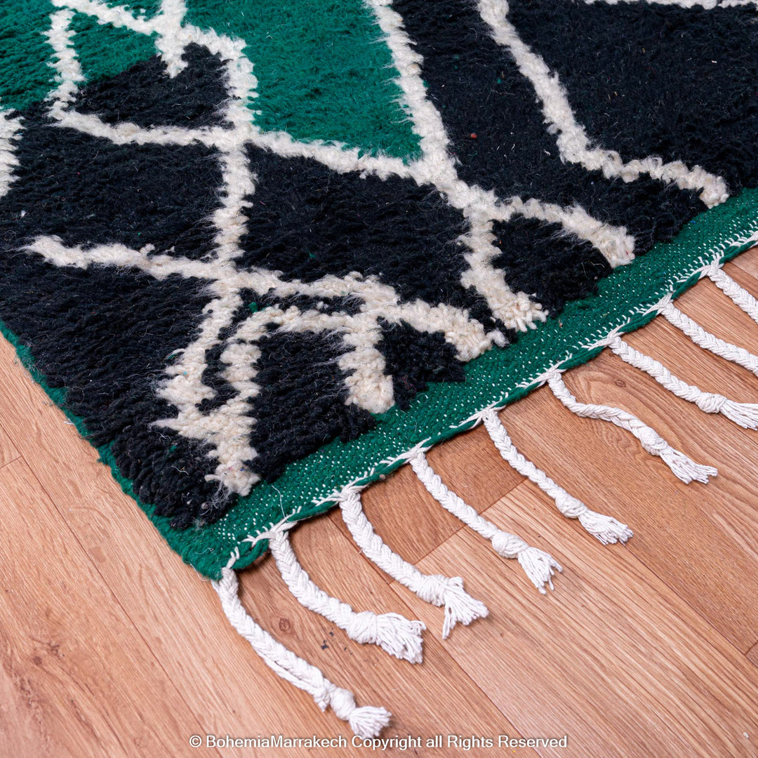 Green Moroccan rug with white tribal diamond lines and navy border, handmade in Beni Ourain wool style